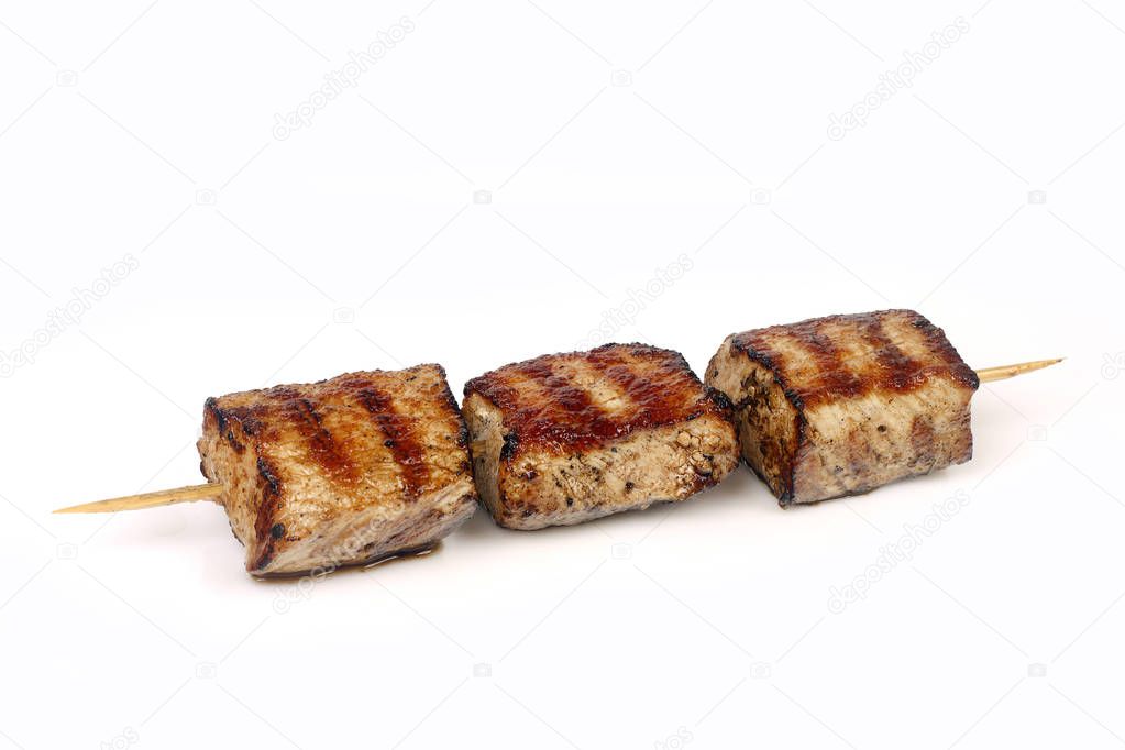 pork meat grilled on a sprig on a white background for isolation