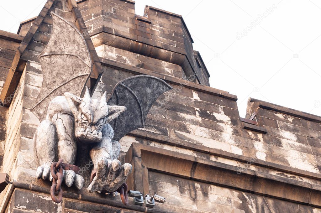 Gargoyle sitting at entrance of Eastern State Penitentiary