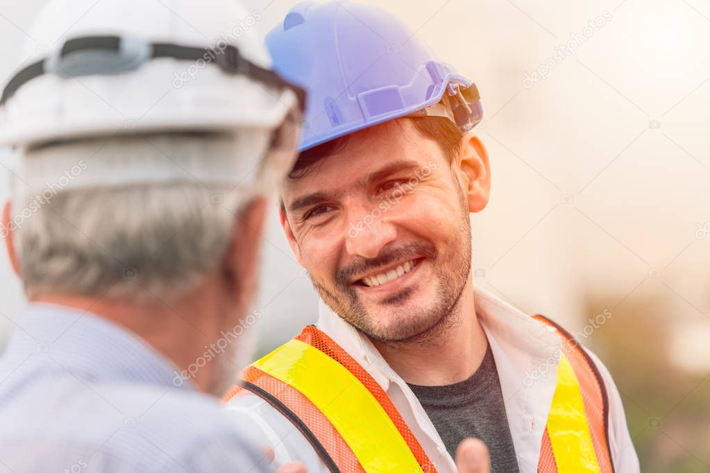 smiling engineer happy to working together talking with business man