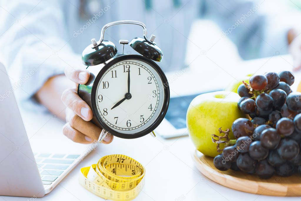 Times to Healthcare or Diet Food advisor show clock for timing care your health with healthy food and concept.