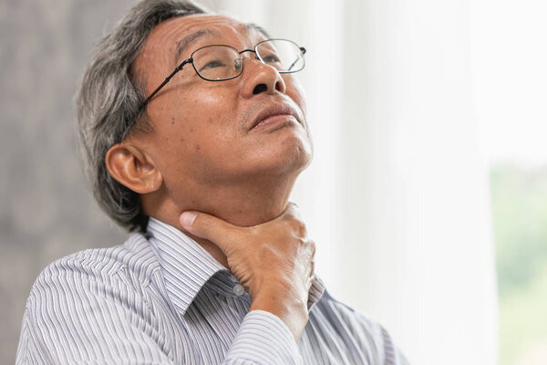 elderly sore throat irritation hand massage squeeze at neck