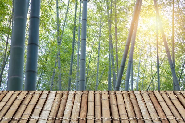 Bamboo forest wood background with wooden table for nature products show