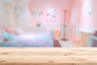 Wood foreground with blur pink lovely bedroom blur background for display products clipart