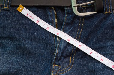jeans open zip with measuring tape, penis size concept