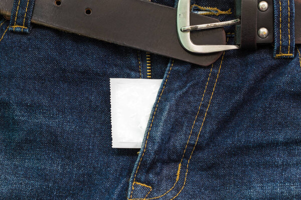 jeans open zip with condom, safe sex concept