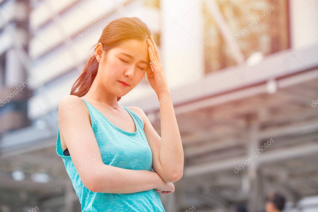 Girl teen headache from  sun stroke sunny hot day heat migraine pain.