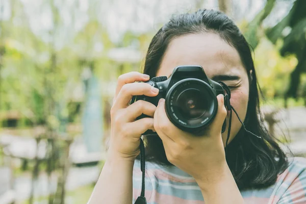 Asian Girl Teen using DSLR Camera Photography Vintage color tone