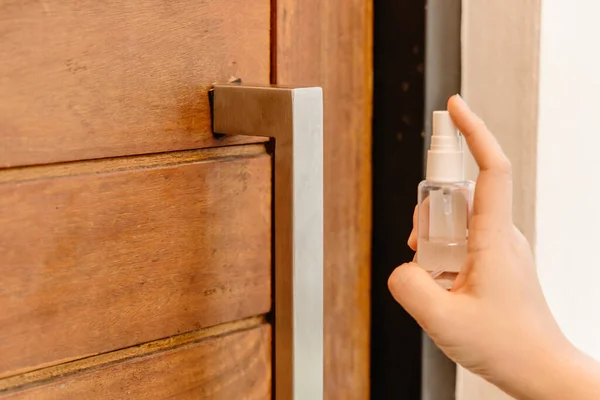 Closeup People Using Alcohol Disinfectant Spray Cleaning Door Handle Preventing — Stock Photo, Image