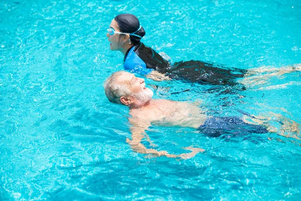 elder swimming the pool together happy relax enjoy in summer season