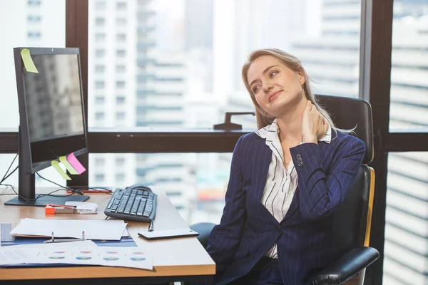 Business woman neck pain from longtime hard work in office.