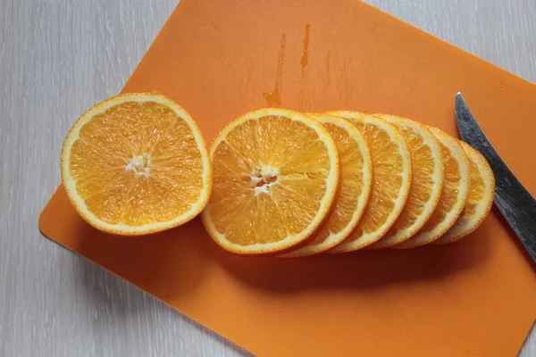 Orange, cut circles lies on the board