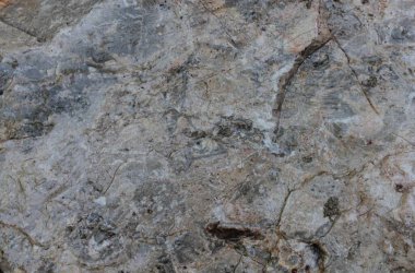 Arkaplan için kullanılacak çatlaklı taş duvarların dokusu.