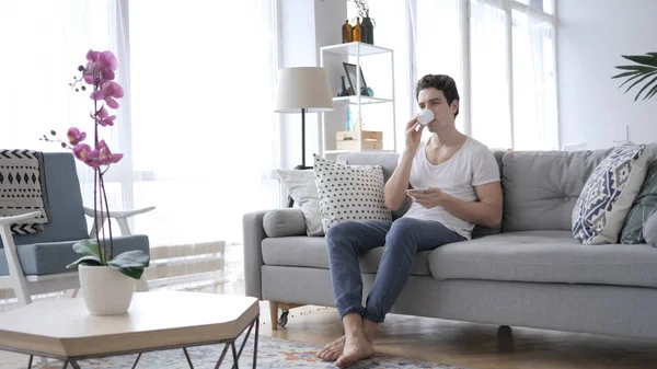Man Drinking Coffee While Sitting Sofa Home — Stock Photo, Image