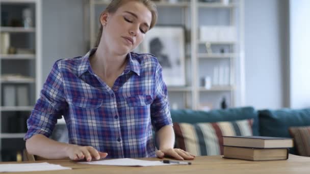Tired Young Woman Relaxing while Writing Documents — Stock Video