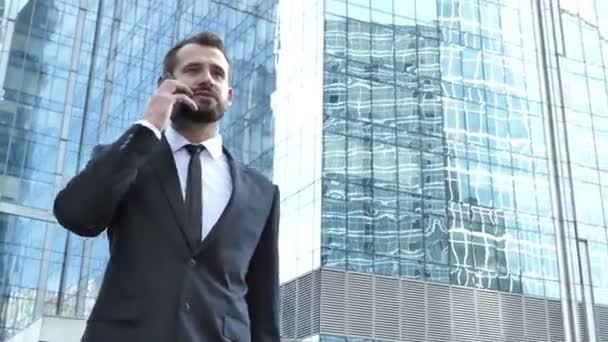 Walking Businessman Talking Phone — Stock Video