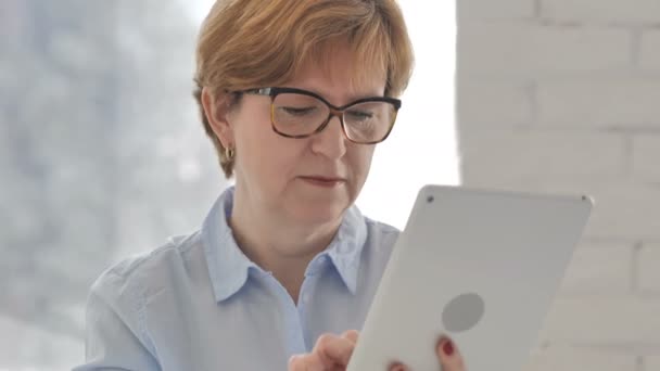 Old Woman Using Tablet Celebrating Success Project — Stock Video