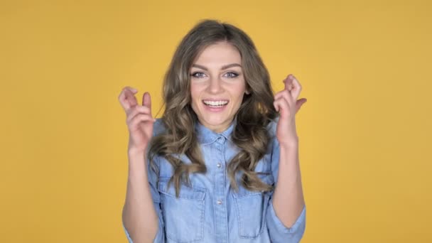 Worried Young Girl Standing Finger Crossed Good Luck Yellow Background — Stock Video