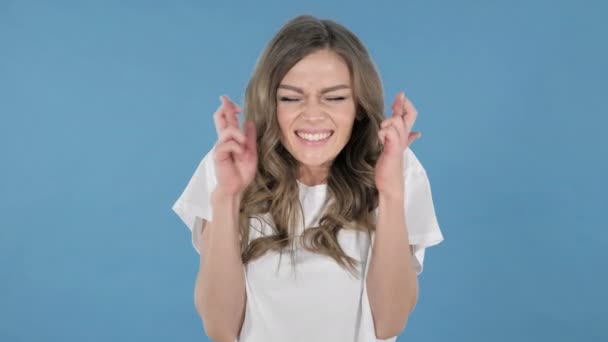 Worried Young Girl Standing Finger Crossed Good Luck Blue Background — Stock Video