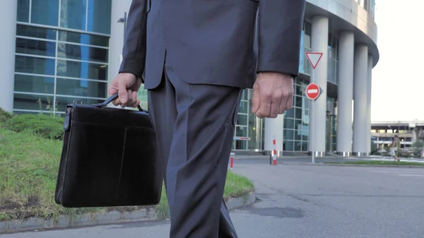 Front view of Walking Businessman Legs and Handbag