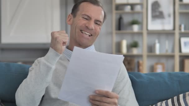 Excited Middle Aged Man Cheering while Reading New Contract — Stock Video