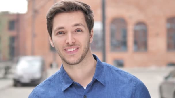 Outdoor Standing Young Man Pointing with Finger toward Camera — Stock Video