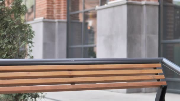 Young Man Coming and Sitting on Bench to Use Laptop — Stock Video