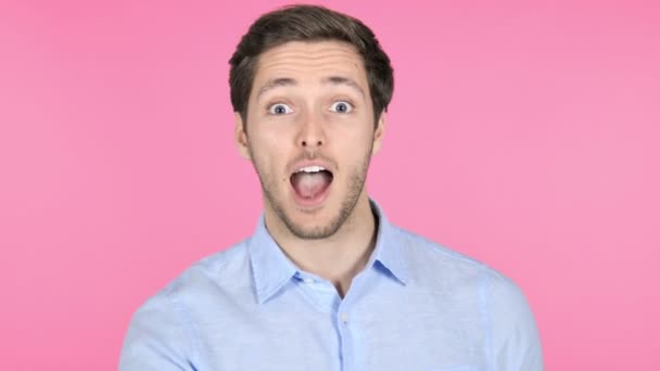 Finger on Lips by Young Man Isolated on Pink Background — Stock Video