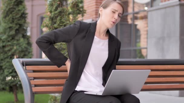 Young Businesswoman with Back Pain Working on Laptop Outdoor — Stock Video