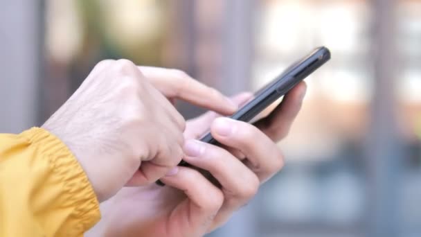 Outdoor Close Up of Hand Using Smartphone — Stock Video