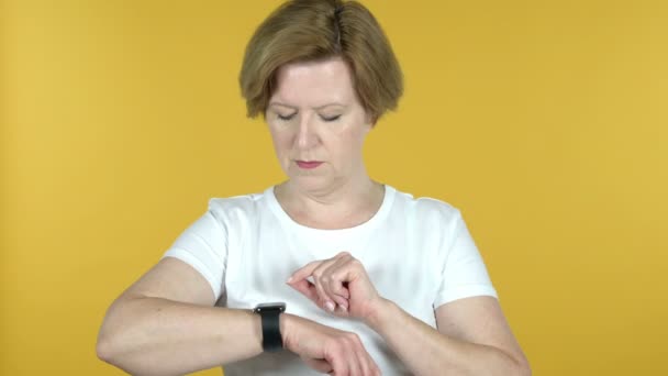 Old Woman Browsing Internet, Using Smartwatch — Stock Video