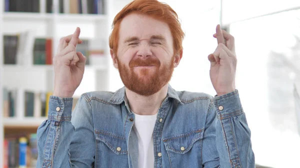 Fingers Crossed, Stressed Redhead Man Wishing for Win — Stok Foto