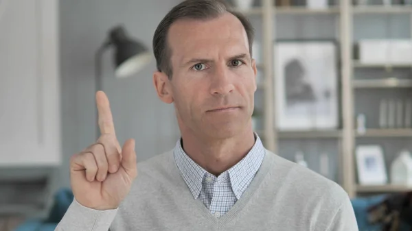 No, Middle Aged Man Rejecting Offer by Waving Finger
