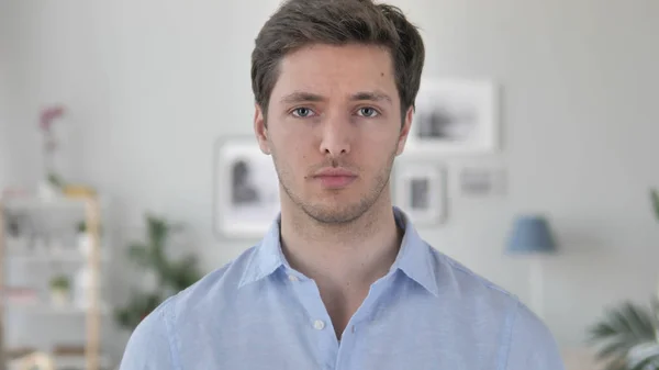 No, Handsome Young Man Rejecting Offer by Shaking Head