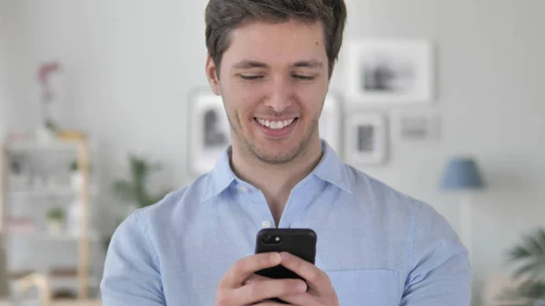 Handsome Young Man Busy Using Smartphone — Stock Photo, Image