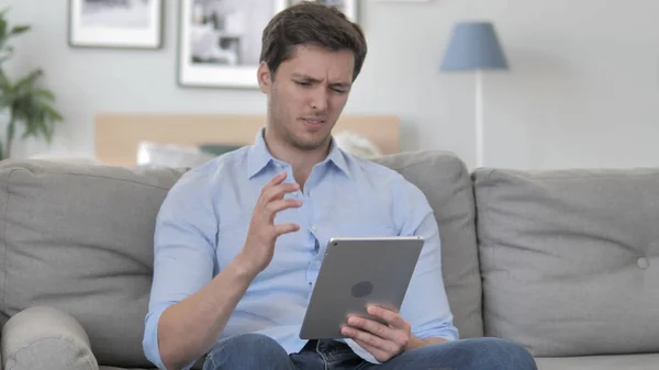Handsome Young Man in Shock by Loss while Using Tablet — Stock Photo, Image