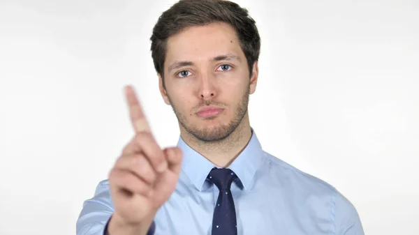 Avvisa unga affärsman vifta finger på vit bakgrund — Stockfoto