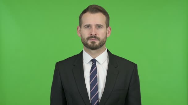 Smart Businessman doing No Sign by Head against Chroma Key — Stock Video