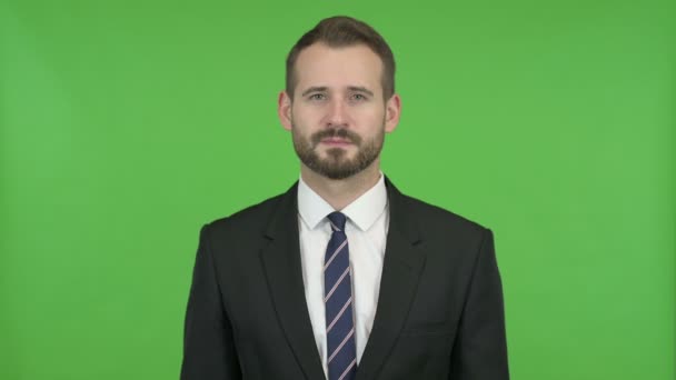 Ambitious Businessman Showing Victory Sign against Chroma Key — Stock Video