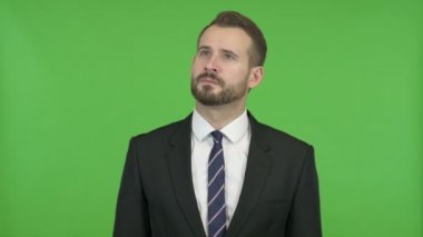 Hırslı İşadamı Chroma Key karşı bir şey düşünme