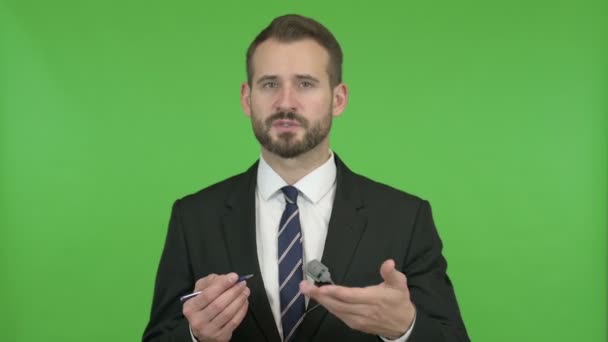 Handsome Businessman giving Presentation against Chroma Key — Stock Video