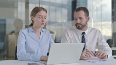 Executive Business people Discussing project on Laptop Screen