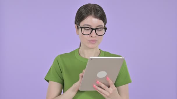 Successful Young Woman using Tablet on  Pink Background — Stock Video