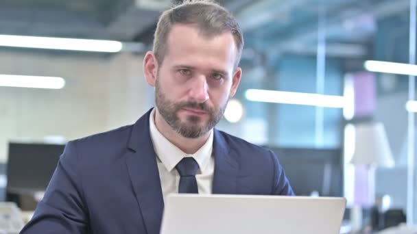 Portrait of Businessman getting Upset while working on Laptop — Stock video