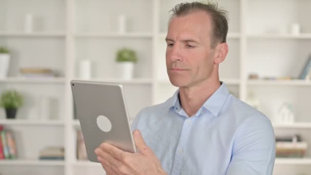 Portrait of Serious Middle Aged Businessman using Tablet — Stock Video