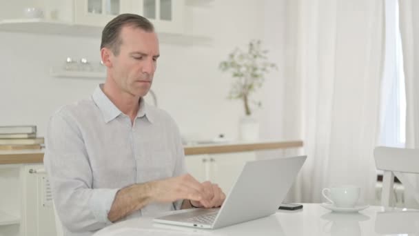 Sick Middle Aged Man with Laptop Coughing at Home — Stock Video