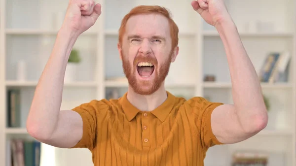 (Inggris) Happy Redhead Man Celebrating Win — Stok Foto