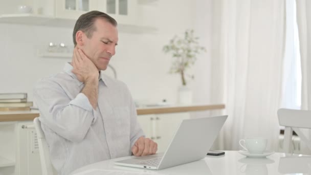 Middle Aged Man with Laptop having Neck Pain at Home — Stock Video