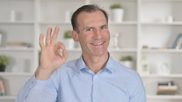 Portrait of Positive Middle Aged Businessman showing OK Sign — Stock Photo, Image