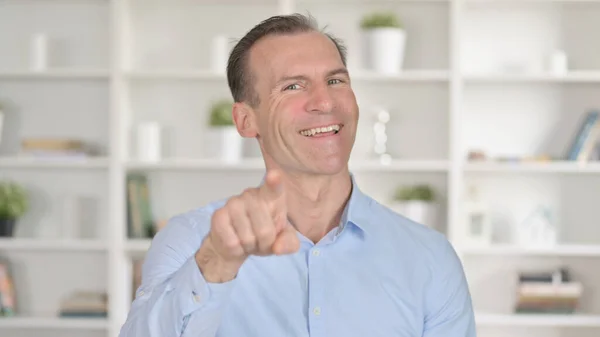 Portrait of Cheerful Middle Aged Businessman Pointing Finger — Stock Photo, Image