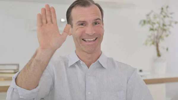 Portrait of Middle Aged Man Waving on Video Call — Stock Photo, Image
